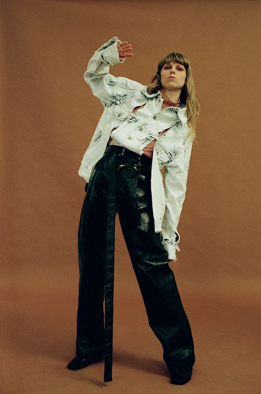 Model wearing an outfit from brand HEW