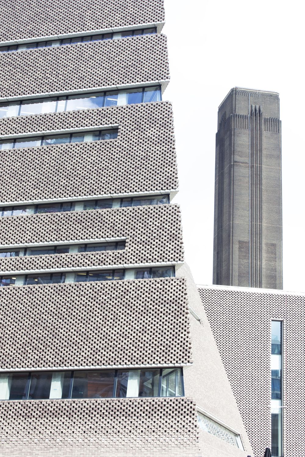 an external shot of tate modern with another building in the background