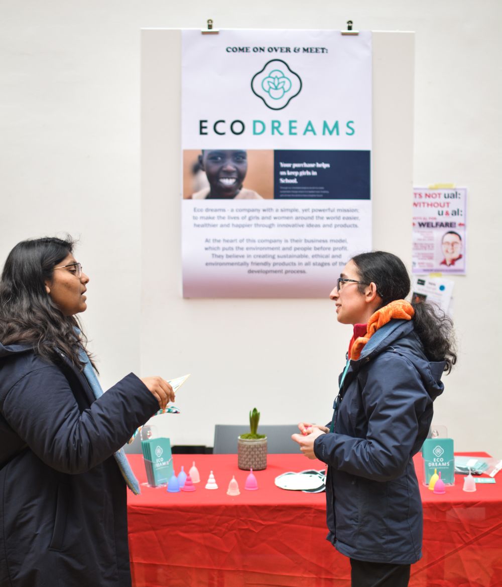 lady talking in front of ECO Dreams poster