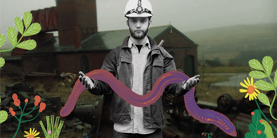 A young man wearing a white miner's helmet and denim jacket holds a large purple snake in both hands, the image is part photograph and part illustration