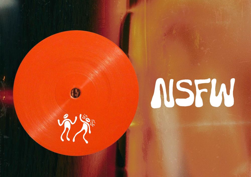 A red vinyl record with two simple white stick‑figure drawings near the edge, set against a blurred background with the white text “NSFW” on the right.