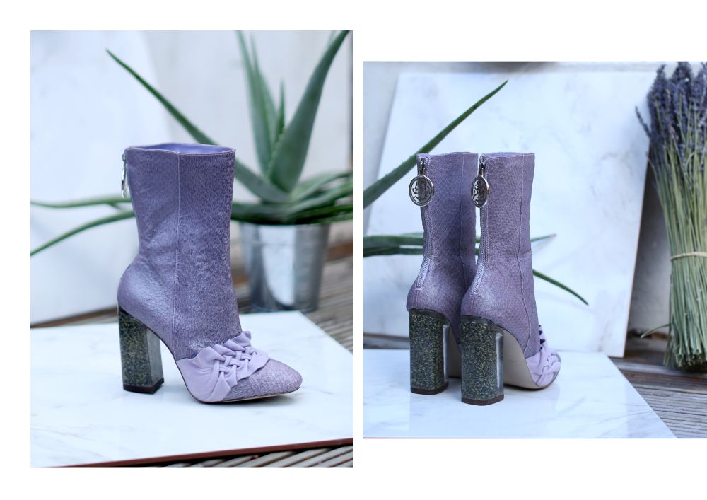 Mauve boot with plant in the background