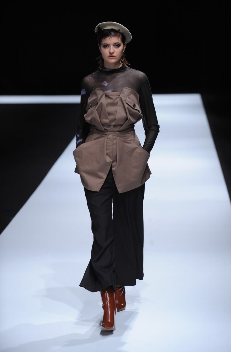 Female model wearing a two piece suit designed by Yebin Maeng