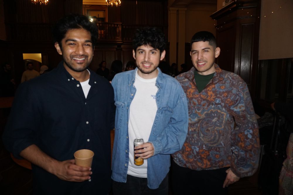 three students posing for a photograph