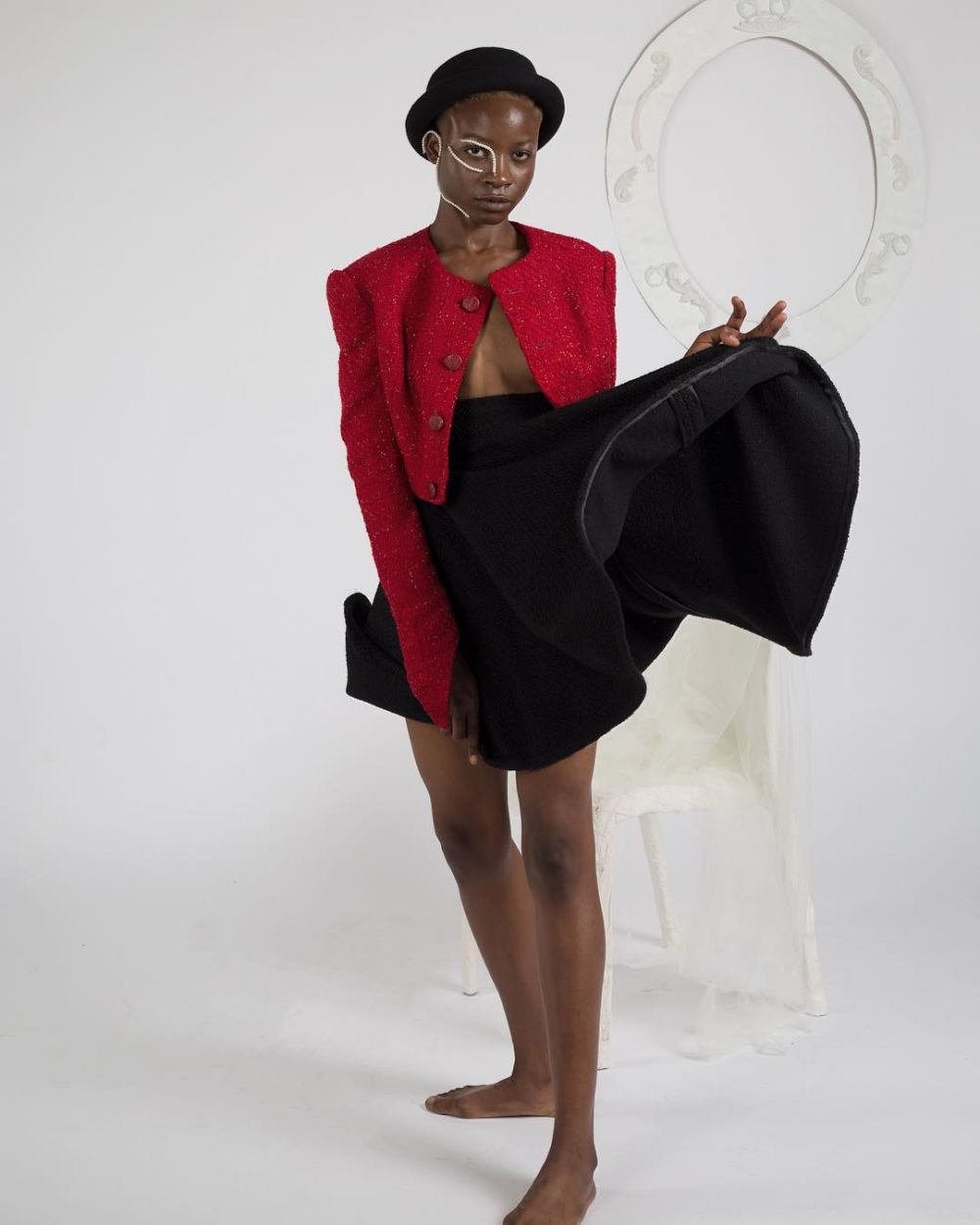 Female model wearing a jacket and a skirt