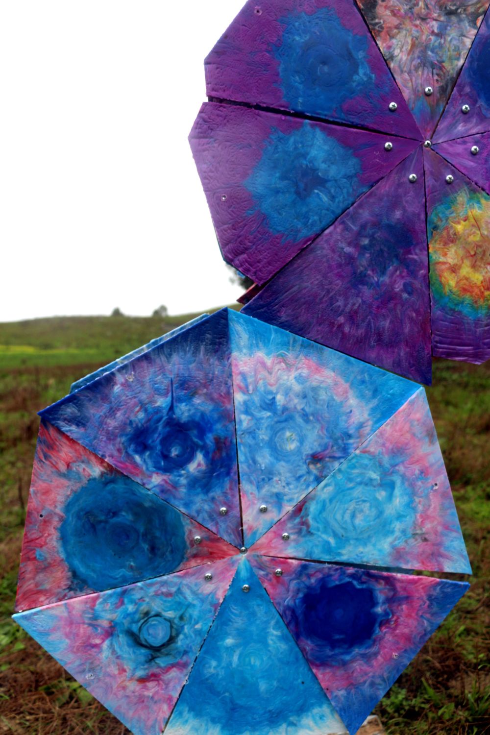 a close up of a plastic sculpture in a field