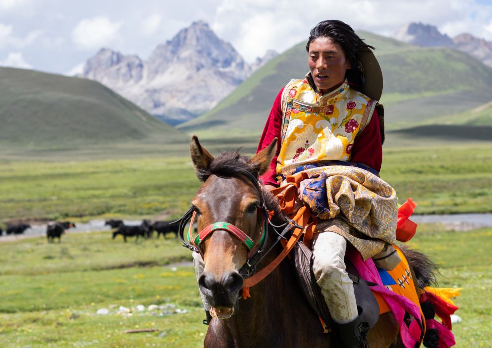 woman riding horse back in Asia