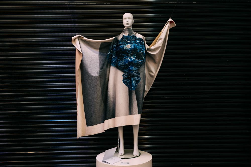 Costume display on mannequin with black shutter backdrop
