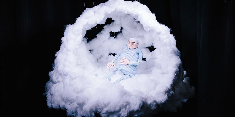 3D animation prop of an old man floating in a cloud