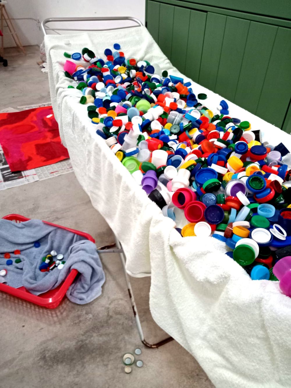 work in progress image of bottle caps ready to be melted