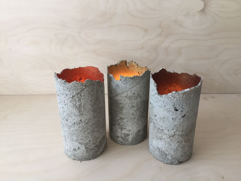 Three grey candle holders