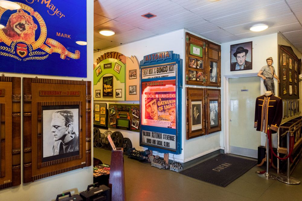 Corridor of The Cinema Museum, filled with vintage cinema objects, posters and costumes.