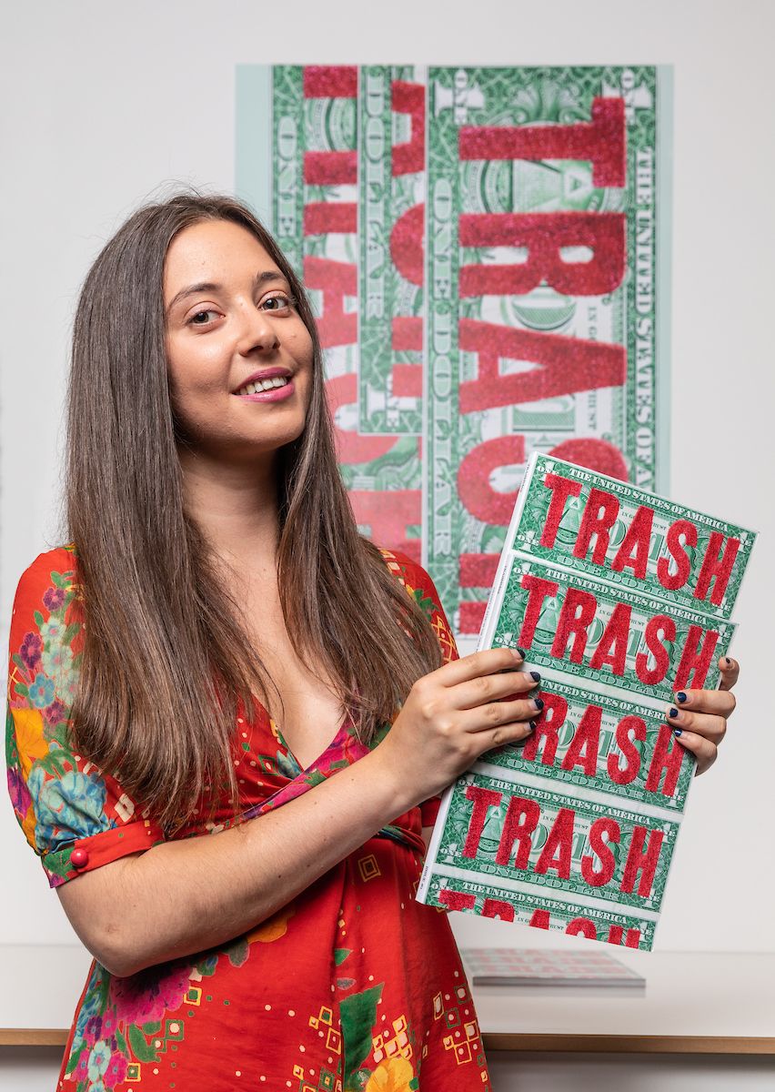 Portrait of woman holding Trash magazine