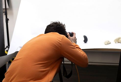 Photographer taking photo of objects
