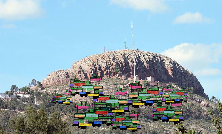 Illustration of coloured structures set against mountains