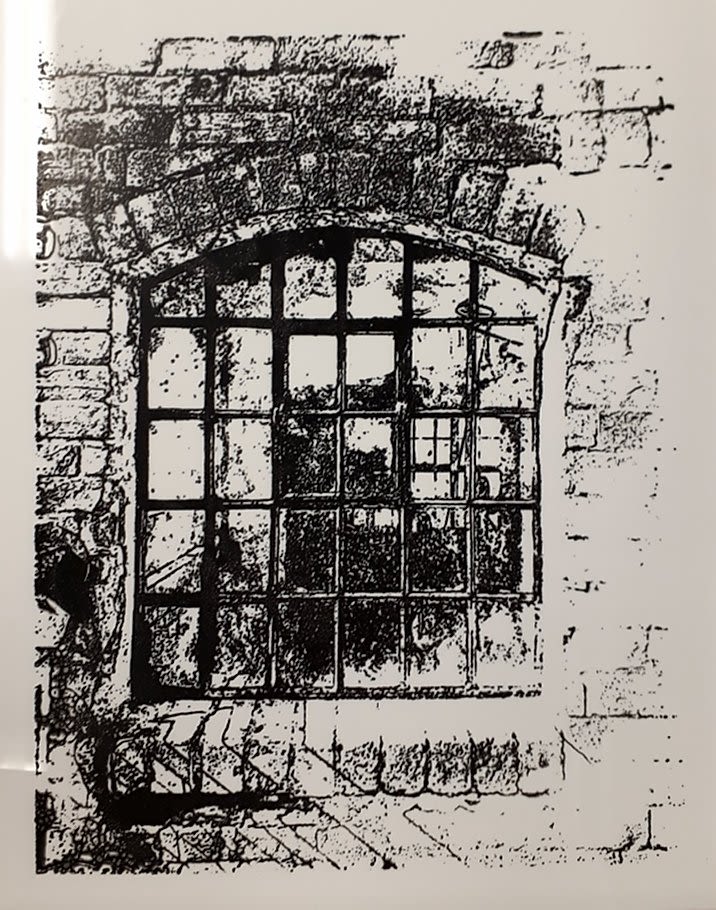 Black and white drawing of window in a brick wall