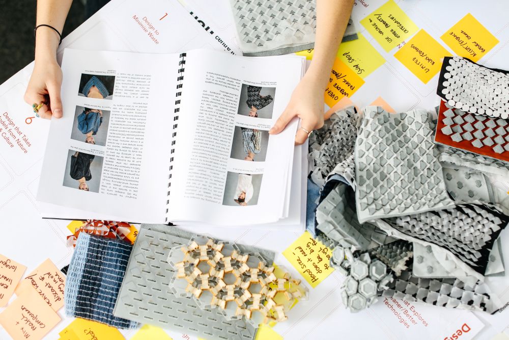Laetita Forst's workspace with materials, samples and notebooks.