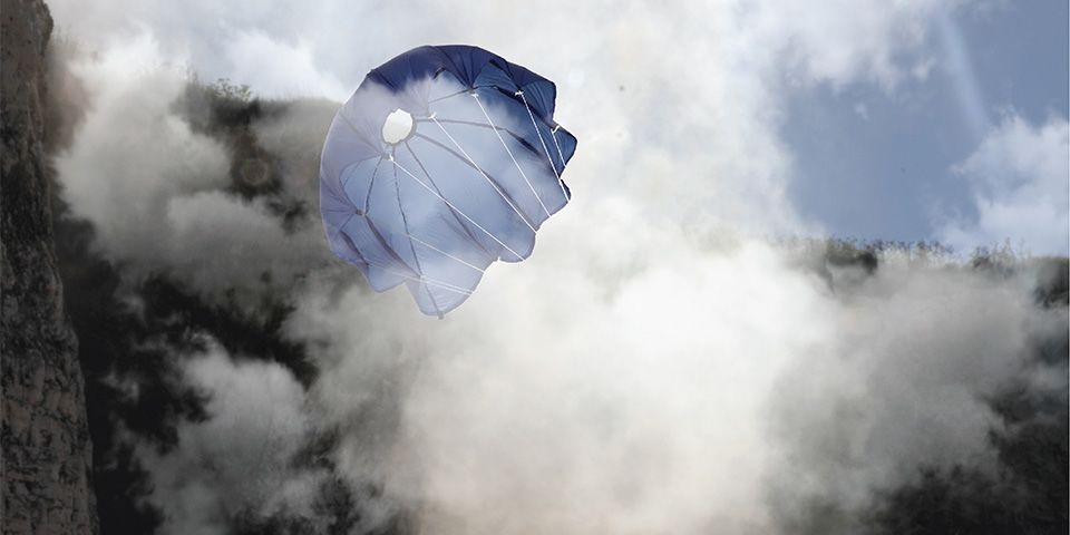 A blue cloud catcher floating through the sky