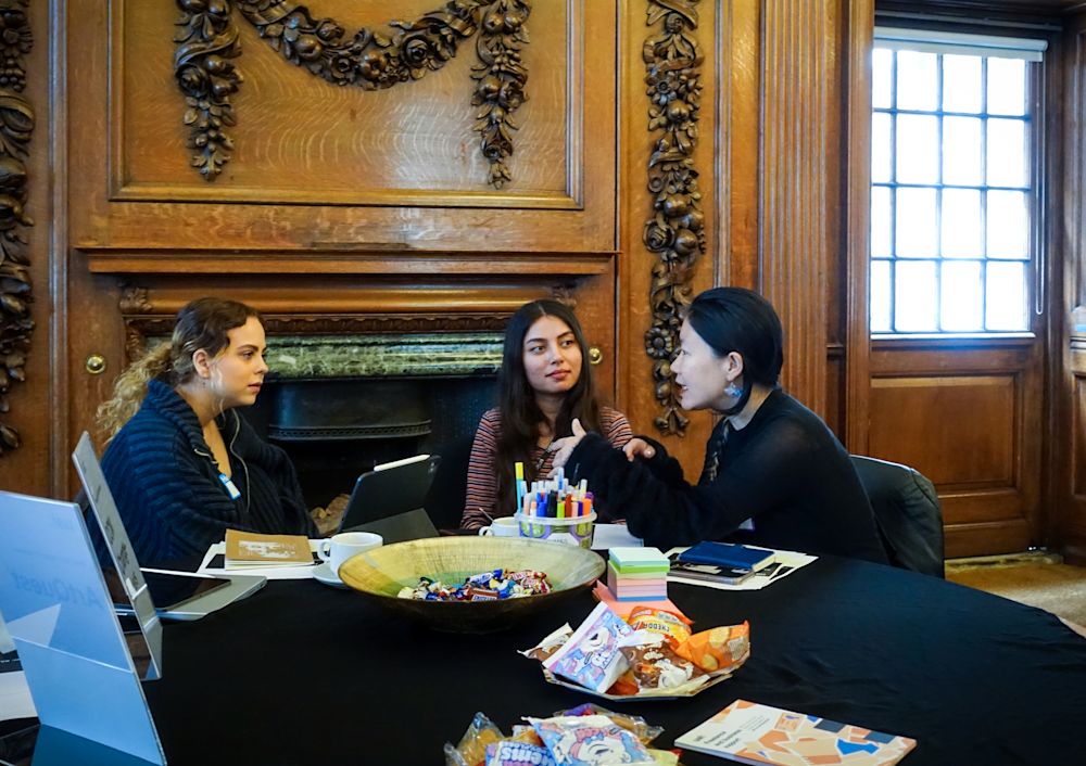 Students talking at a table