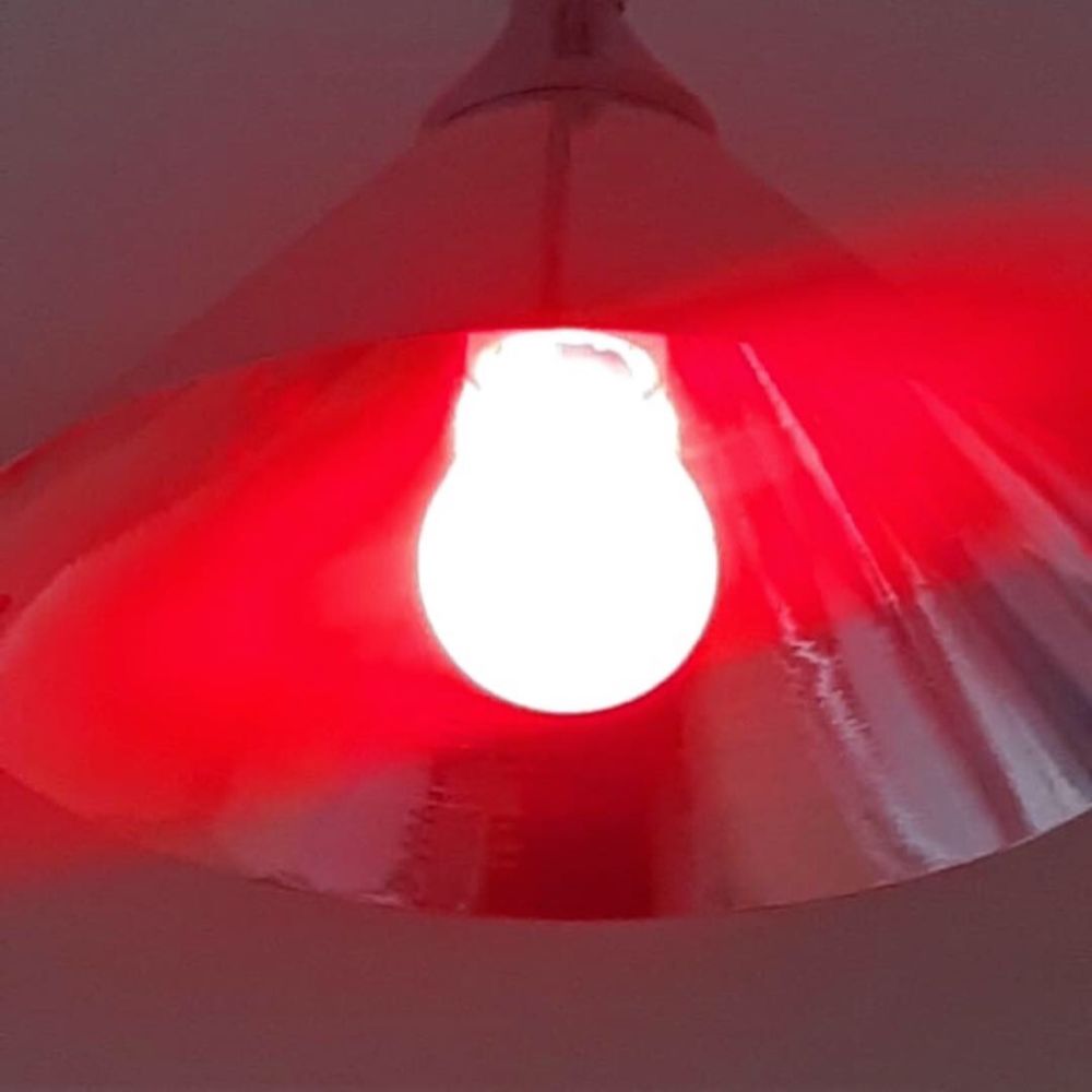 A close up of a red light bulb 