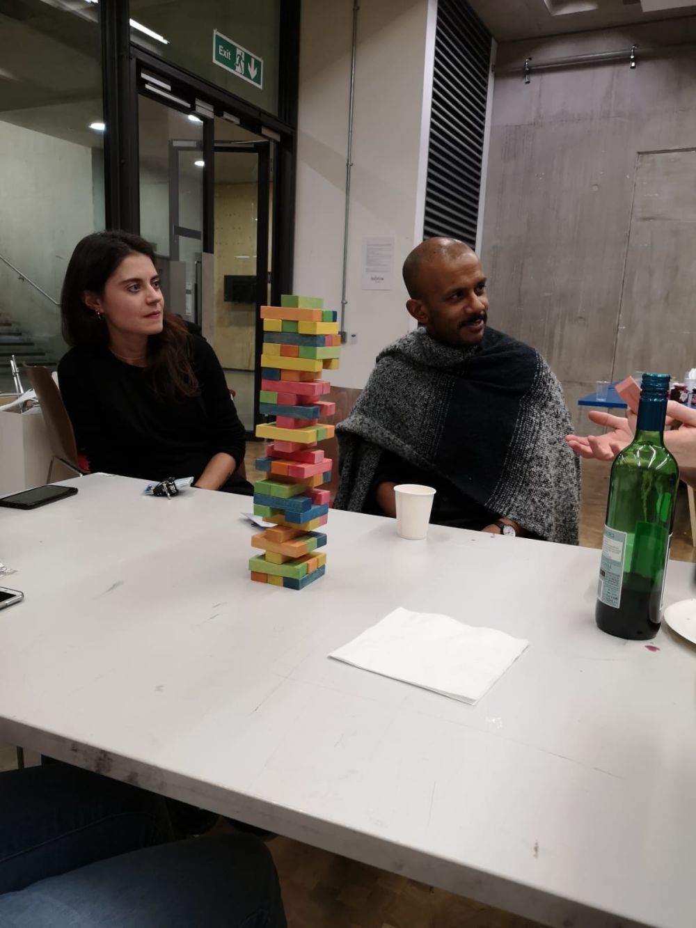 People sitting with coloured blocks on table