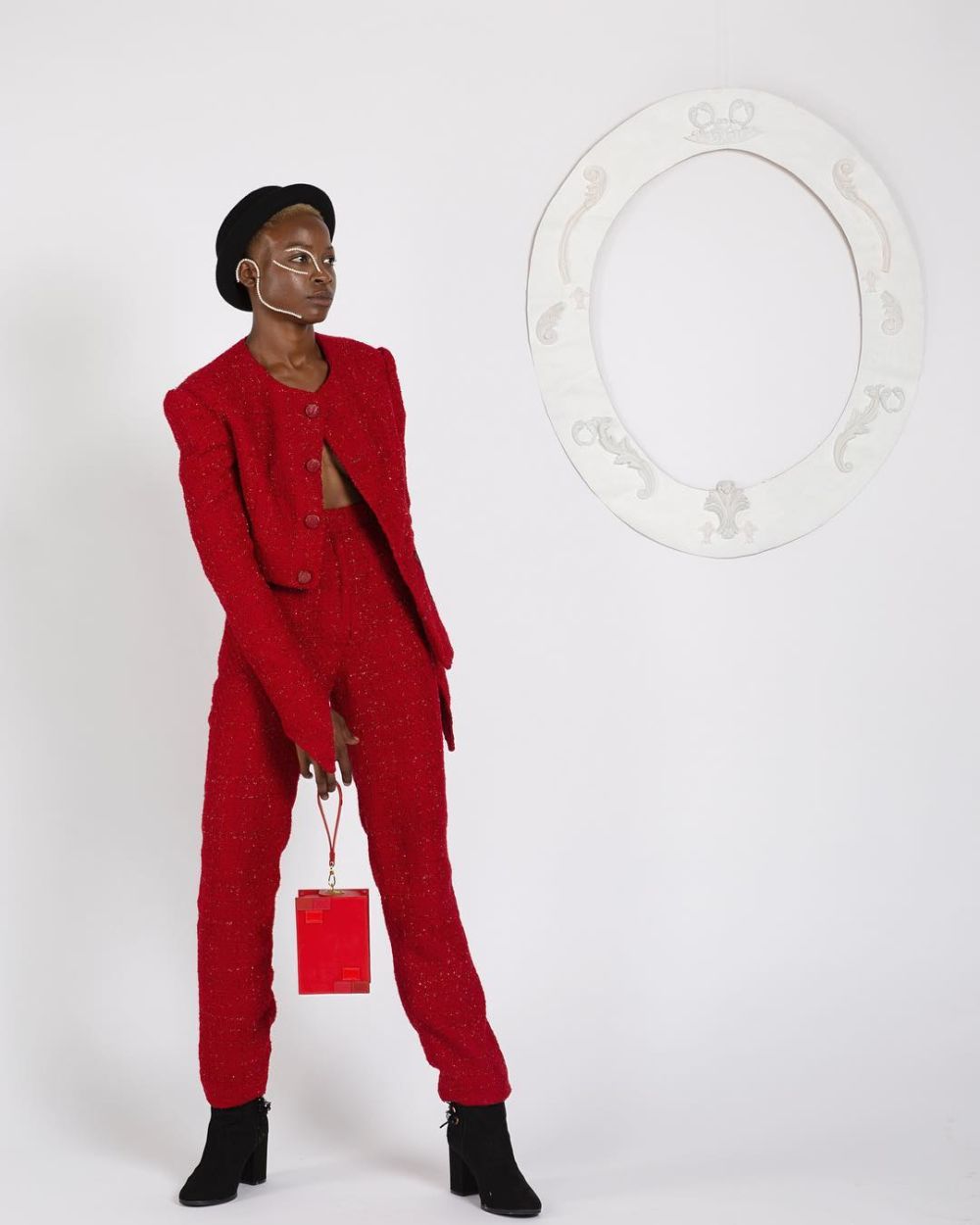 Female model wearing red suit