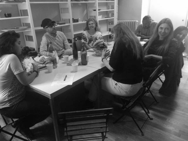 Group of people sat around a table