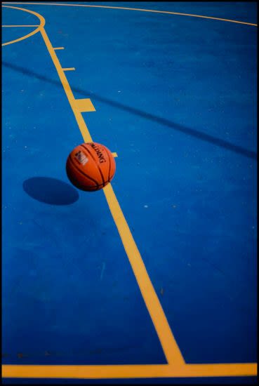 ball on blue basketball court