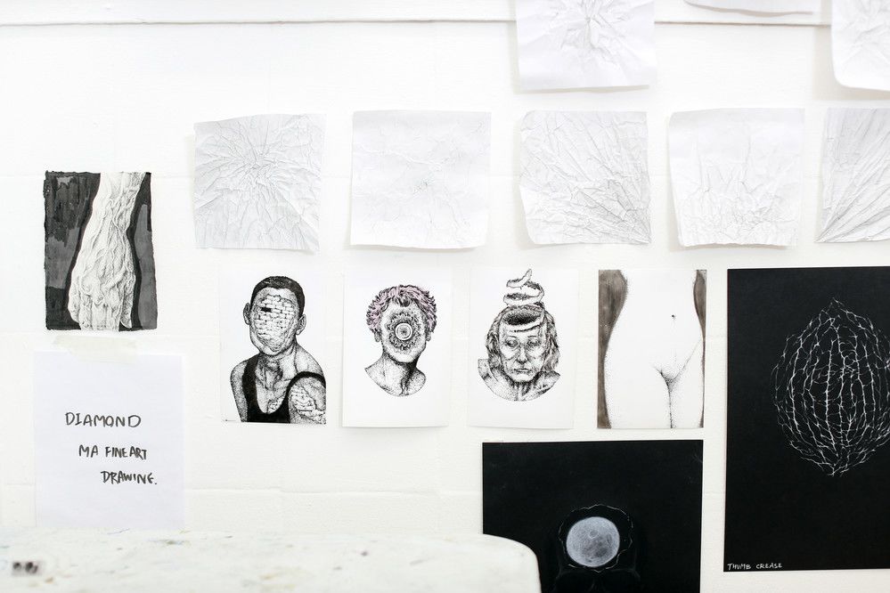 Series of black and white sketches on wall
