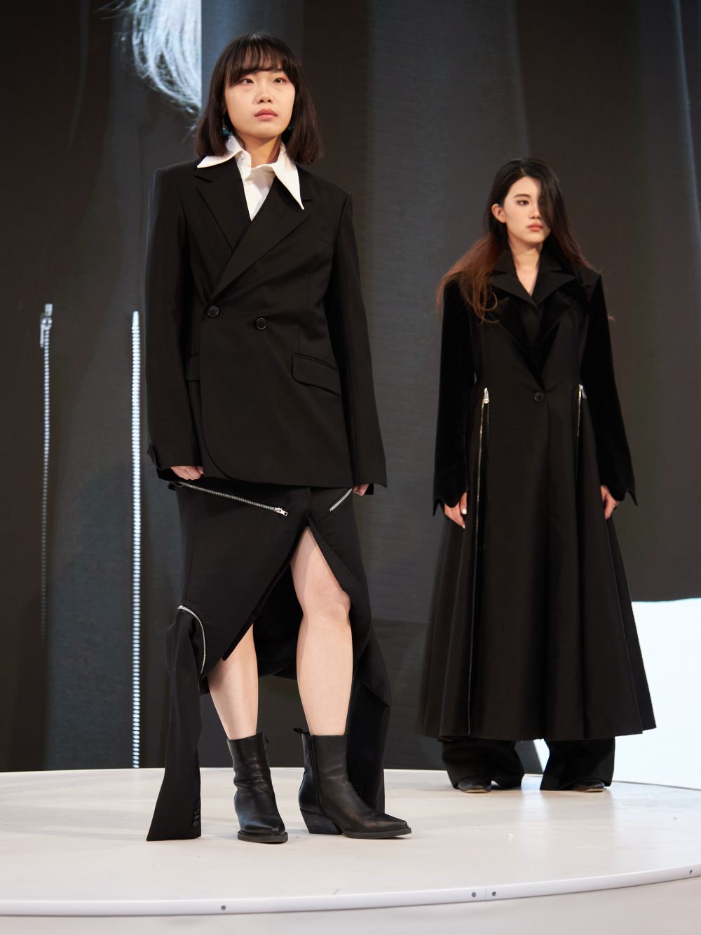 Models wearing black suits