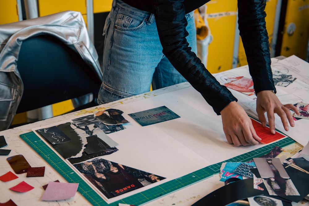 Student working on a moodboard in the Footwear Summer School Short Course