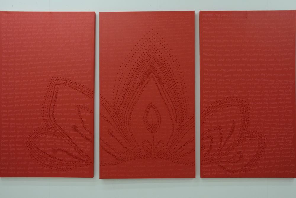 a triptych of red painings