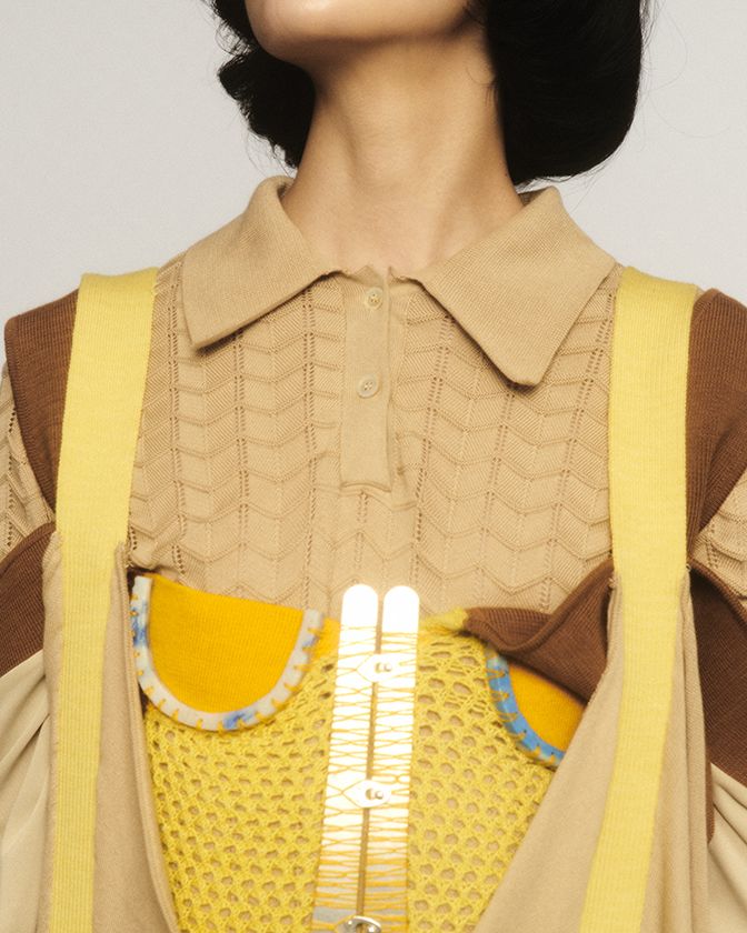 Asian model wearing positive yellow knitwear