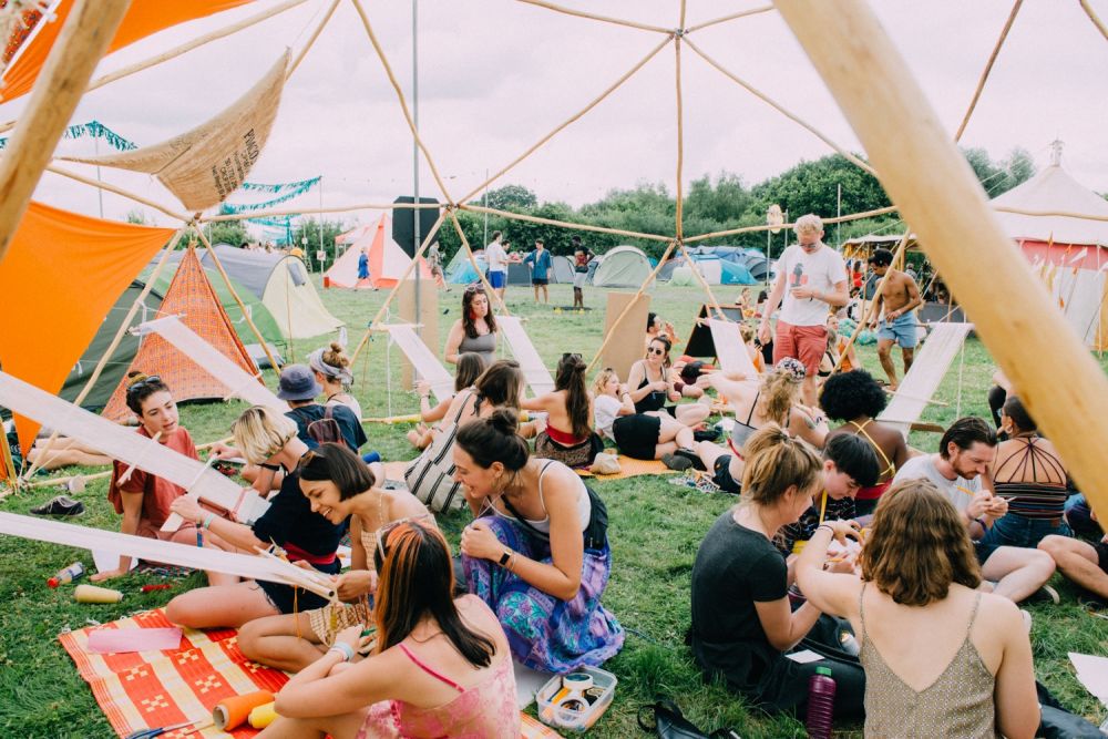 Woven sculpture stands tall above festival goers