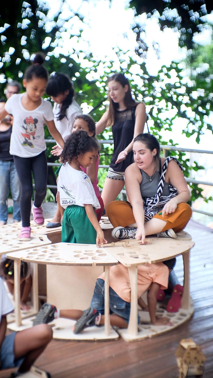 Children playing on wooden structures 