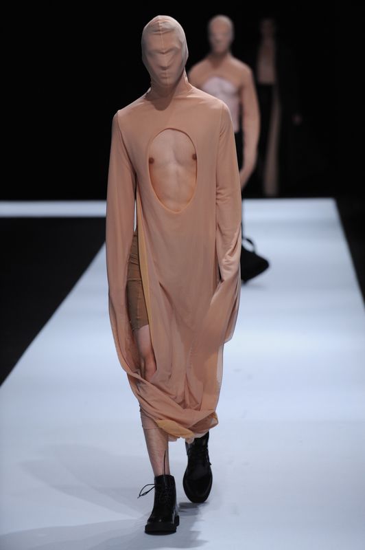 Male model with flesh coloured clothing covering face