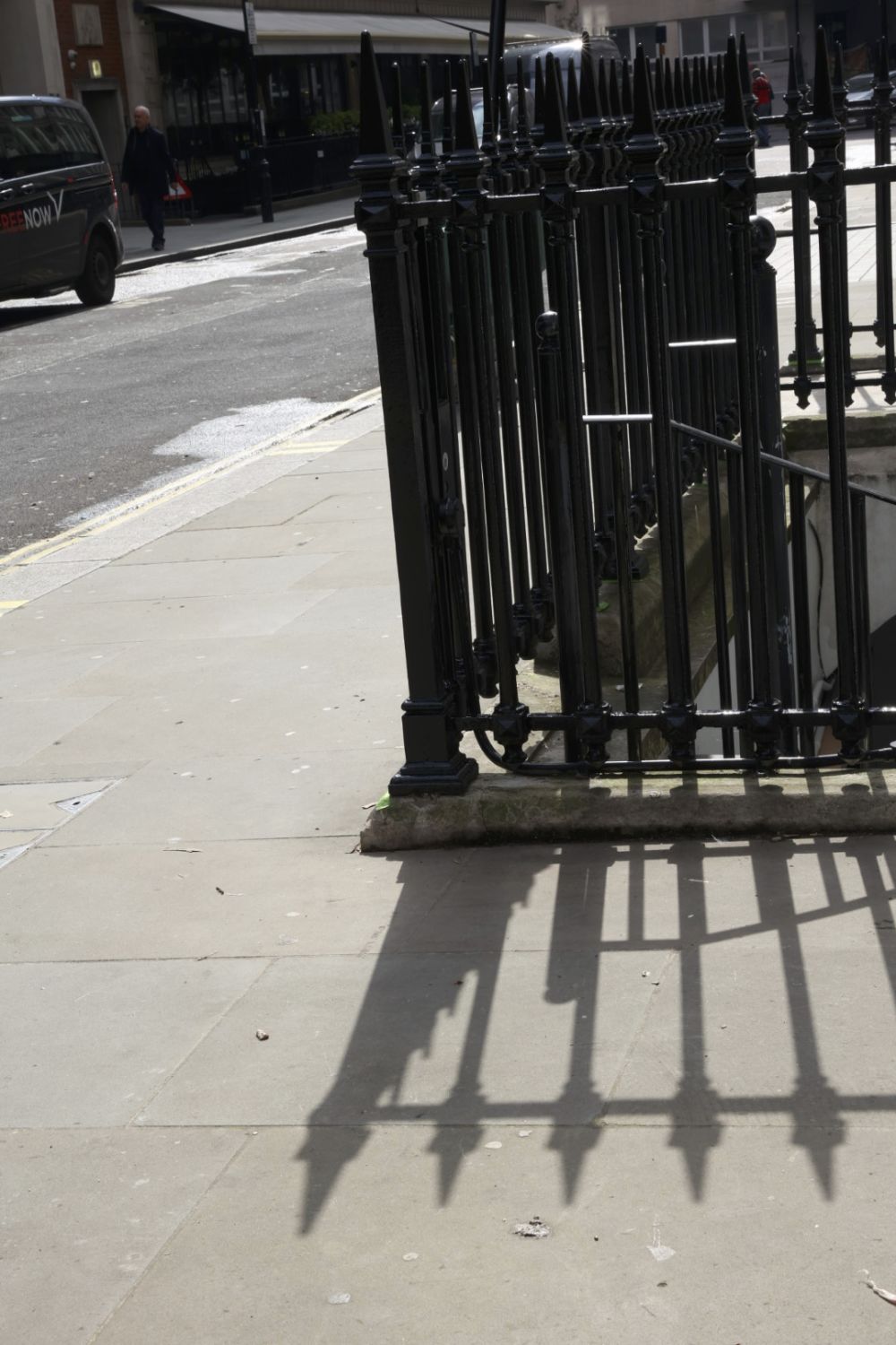 shadows of metal railing