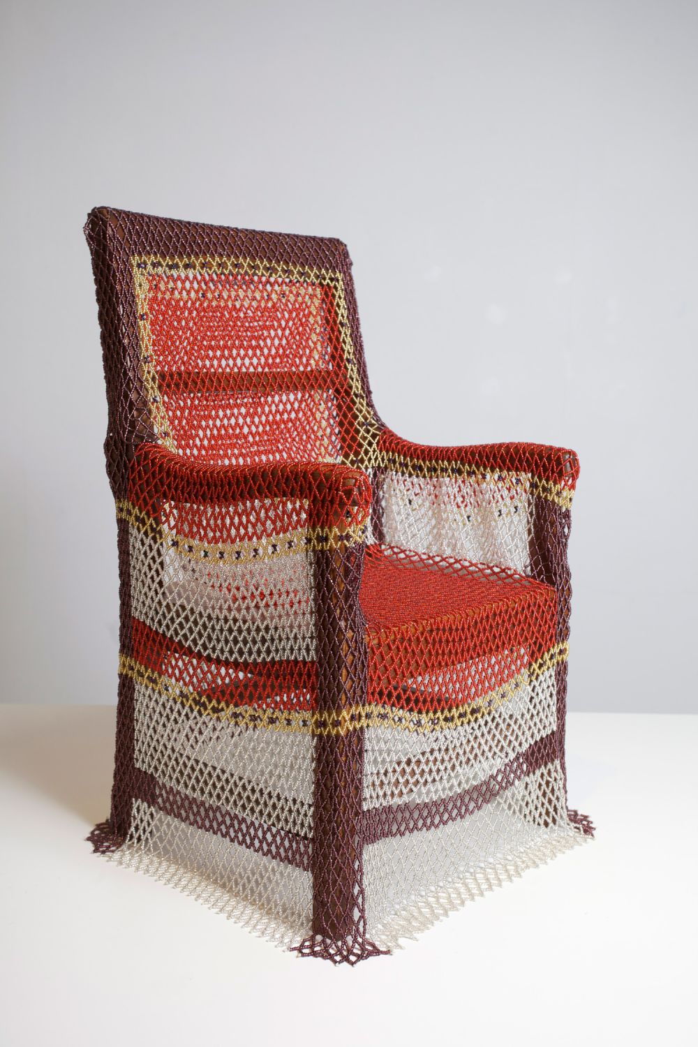 A chair covered in a woven textile