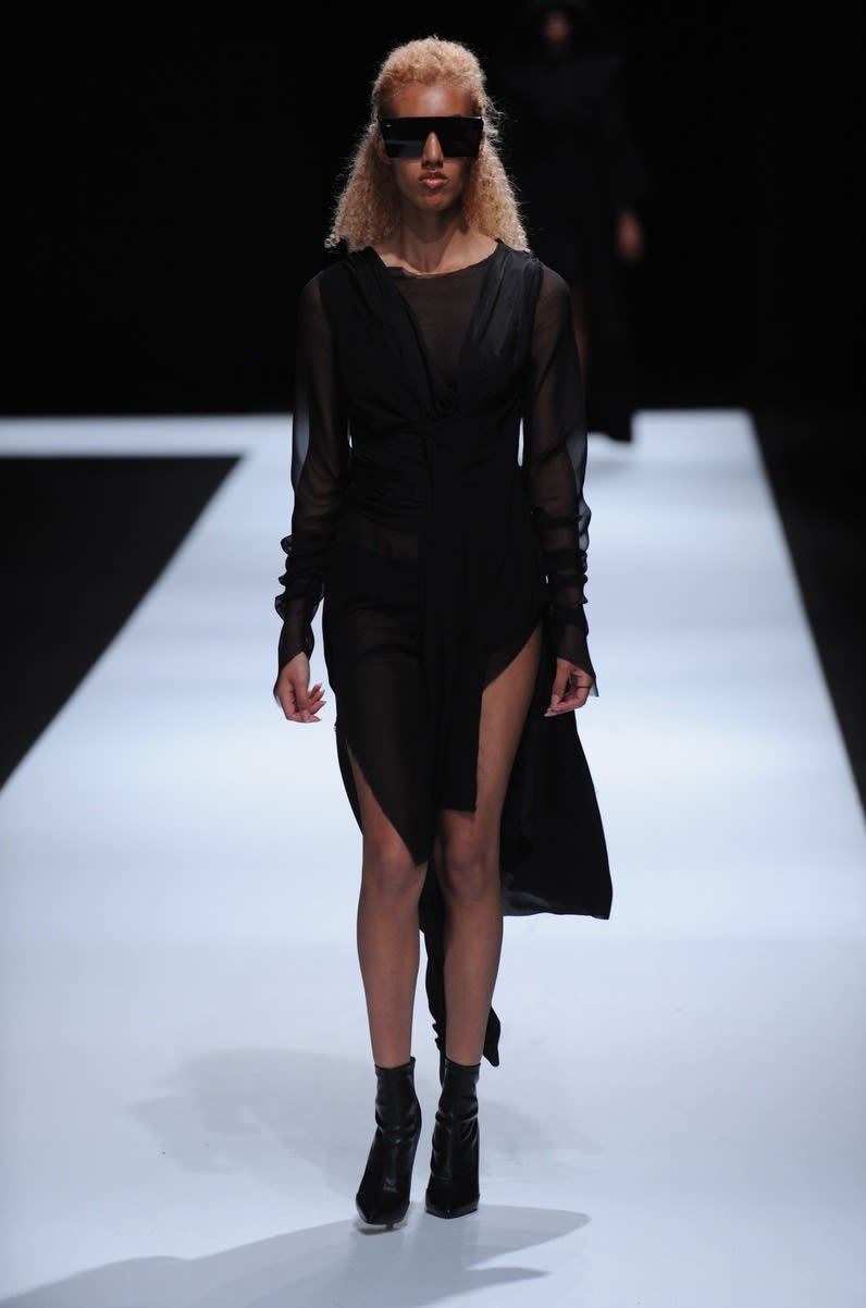 White model wearing asymmetric black dress designed by Jessica Whipp