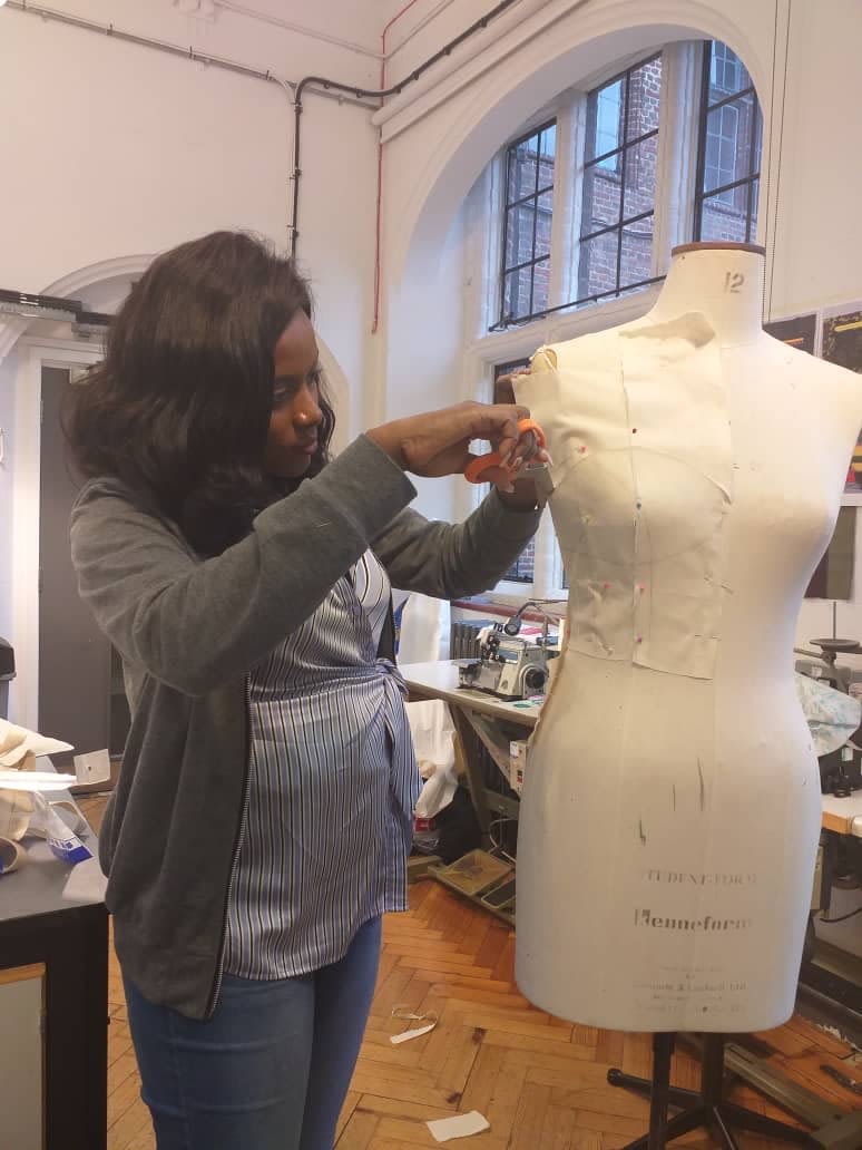 Tope working on her bodice