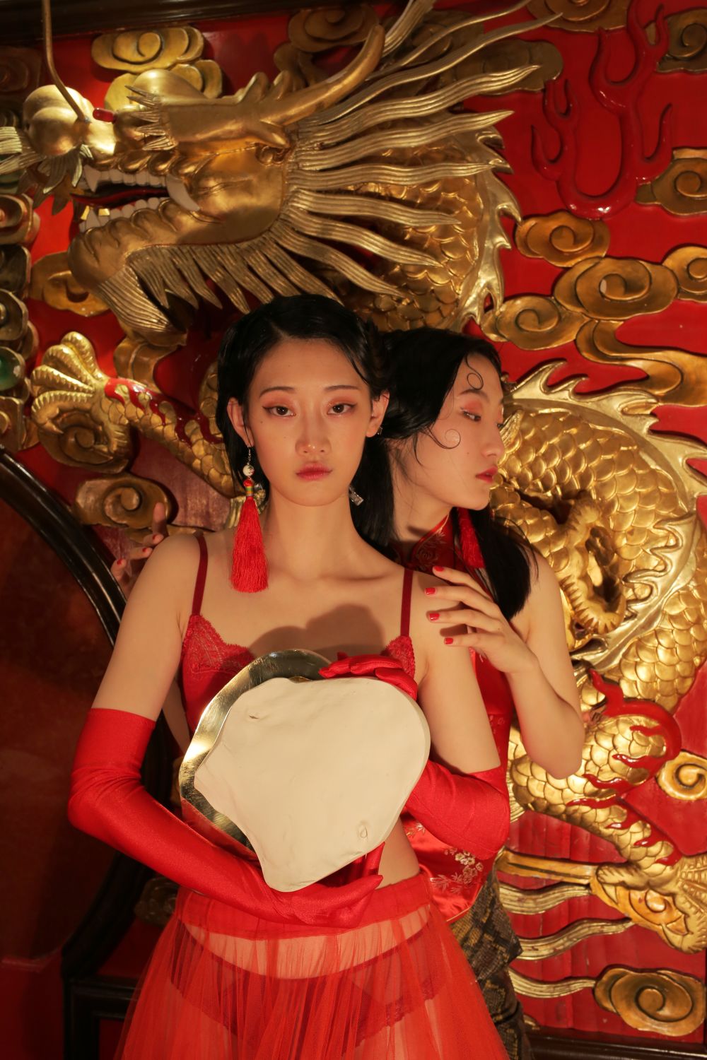 Asian model laying on decorative carpet