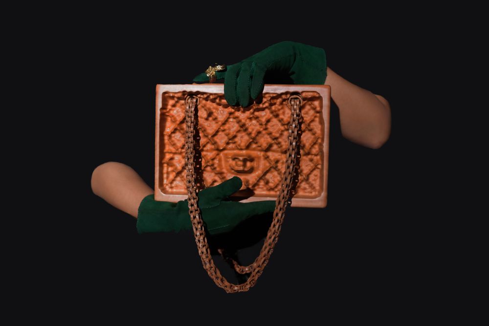 Wooden remake of louis vuitton bag being held