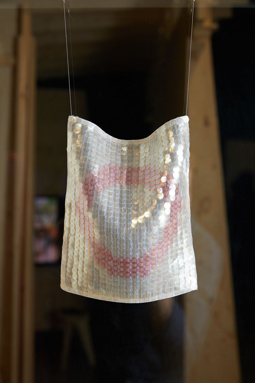 Sequins embroidered onto hanging textile