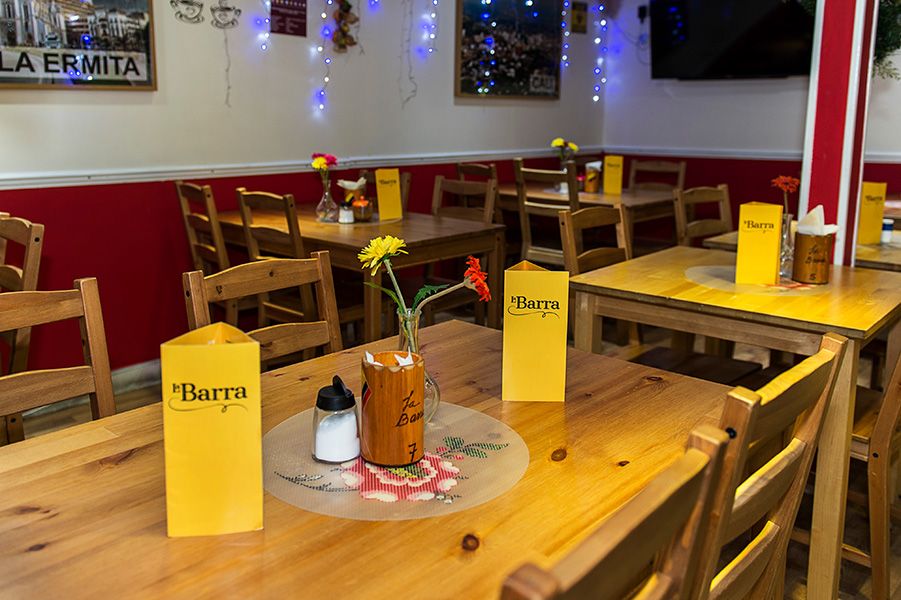 La Barra restaurant, located in one of the arches at the Eagle’s Yard, displaying the new menus designed by Caley Dewhurst.