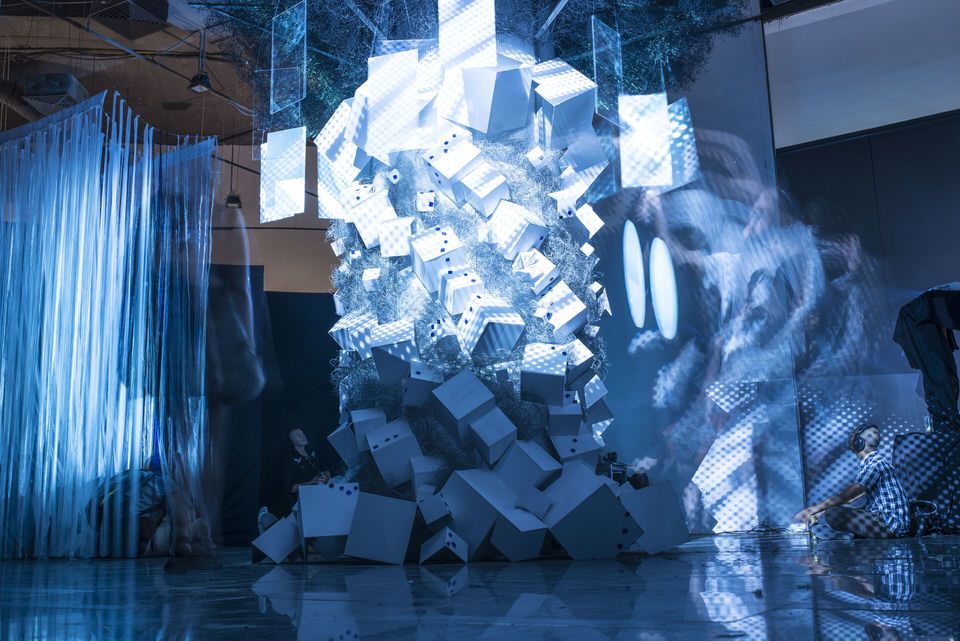 A large installation lit in blue