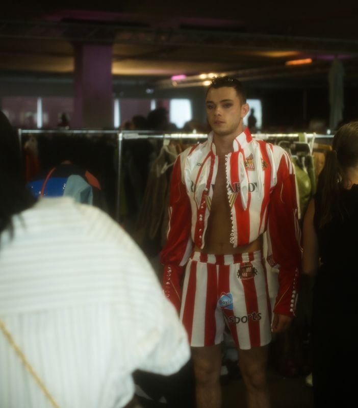 Male model in red an white outfit