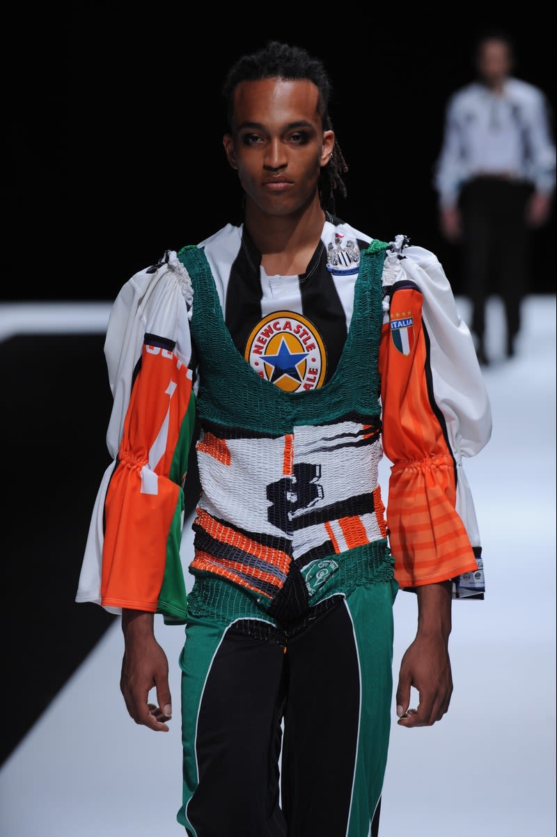 Male model wearing sportive outfit designed by Sophie Hird