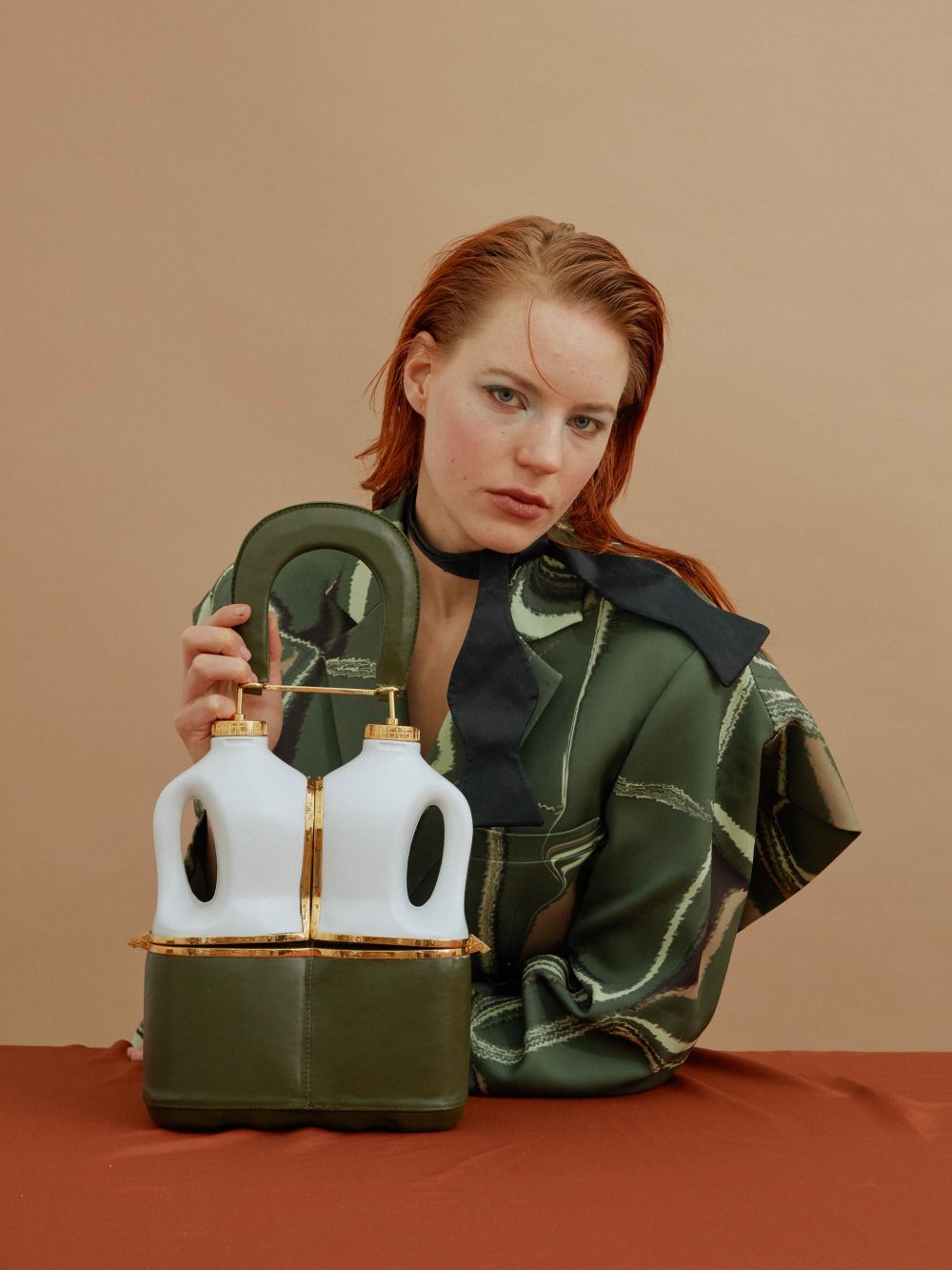 ginger lady sitting at table with bag