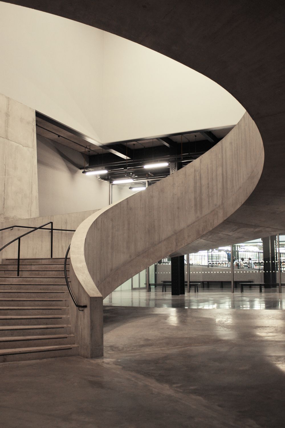 the interiors of the tate modern highlighting a spiral staircase