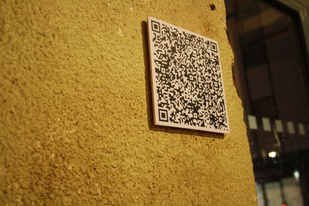 A QR code from an exhibition curated by Elly Clarke in Charlie's old gallery, TROVE, from 2012. Elly introduced her to the idea of QR codes as a form of sharing artwork and information.